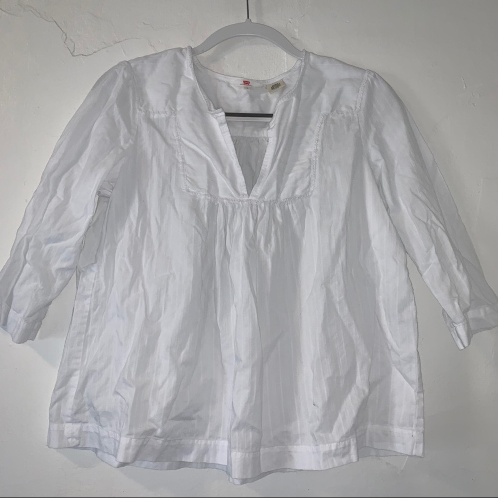 white levi shirt